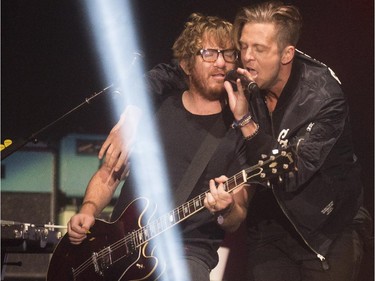 One Republic lead singer Ryan Tedder sings with guitarist Zach Filkins during their concert at the Saddledome in Calgary, on April 30, 2015.