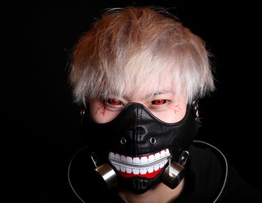 Kaneki Ken (Tokyo Ghoul)
 
Name: Jacky Liang, 20
 
In his own words: “He has a dark personality. He is trying to find out who he is as a ghoul/vampire, but he doesn’t want to be known as that. He wants to be human, too.”
The costume: Liang’s mom helped him sew a long-sleeved shirt under the short-sleeved hoodie and he added the white bands to match Kaneki’s. The coloured contacts were much easier to come by than the partial facemask. Liang first hit up a purveyor of, ahem, custom leather goods — “It was pretty awkward” — before finding this number in a shop in Chinatown for under $20.