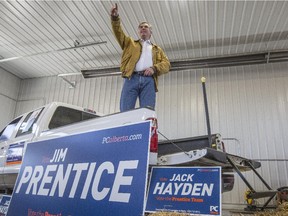 Premier Jim Prentice addresses supporters from the back of a pickup truck on a farm outside Stettler, Alta., as he campaigns around central Alberta, on April 9, 2015.
