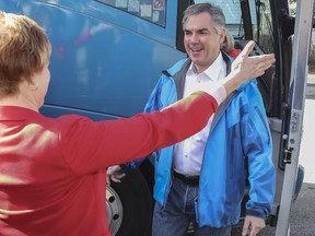 PC Alberta candidate Kerry Towle welcomes Premier Jim Prentice with open arms as he makes an election stop in Innisfail, Alberta, on April 9, 2015.