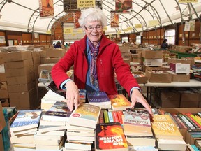 Vounteer Johanna Ermter sorts through some of the thousands of titles at the Calgary Book Drive and Sale Thursday April 30, 2015 at Crossroads Market. Donation are being accepted until Monday May 4 with the sale opening Thursday May 7. Proceeds go to the Servants Anonymous Society.