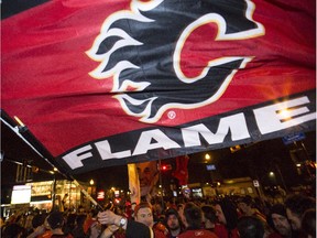 Calgary Flames fans as they walk down 17th Ave S.W., aka. The Red Mile, after the Flames beat the Canucks in game six of the playoffs in Calgary, on April 25, 2015.
