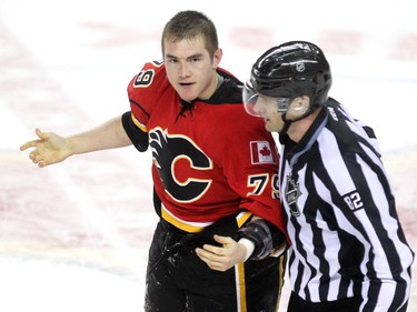 Calgary Flames left winger Michael Ferland was escorted off the ice after a fight in the final minutes of the game against the Vancouver Canucks during third period NHL Game 3 playoff action at the Scotiabank Saddledome in Calgary on April 19, 2015. The Flames defeated the Canucks 4-2 to take a 2-1 lead in the best-of-seven series.
