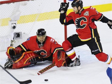 Calgary Flames goaltender Jonas Hiller stopped this scoring chance in the closing minutes against he Vancouver Canucks during NHL playoff  game 4 action at the Scotiabank Saddledome. Calgary won 3-1.