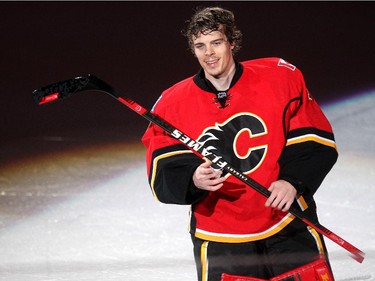 Calgary Flames goalie Jonas Hiller skated a stick over the fans after being named the second star following their win over the Vancouver Canucks in NHL playoff action of game 4 of the series at the Scotiabank Saddledome in Calgary on April 21, 2015. The Flames defeated the Canucks 3-1 to take a 3-1 lead in the best of 7 series.