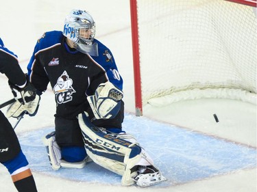 Kootenay Ice goalie Wyatt Hoflin watches the puck go into the net at the Saddledome  in Calgary on Monday, April 6, 2015.