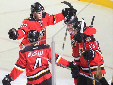 Calgary Flames celebrate their first goal on the Arizona Coyotes at the Saddledome in Calgary on Tuesday, April 7, 2015.