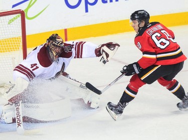 Arizona Coyotes goalie Mike Smith stops a shot from Calgary Flames centre Markus Granlund at the Saddledome in Calgary on Tuesday, April 7, 2015.