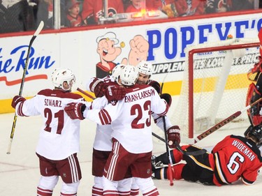 The Arizona Coyotes celebrate their second goal on the Calgary Flames at the Saddledome in Calgary on Tuesday, April 7, 2015.