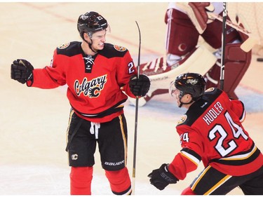 Calgary Flames centre Sean Monahan celebrates the winning goal at the Saddledome in Calgary on Tuesday, April 7, 2015.