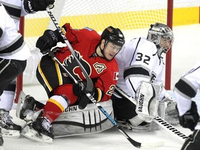 Calgary Flames centre Jiri Hudler got tied up with LA Kings goalie Jonathan Quick in his crease during first period NHL action at the Scotiabank Saddledome on April 9, 2015. The Flames were looking to clinch a playoff spot during their final home regular season game.