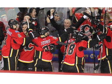 Players on the Calgary Flames bench went wild after centre Jiri Hudler scored the third goal of the game against the L.A. Kings April 9. The Flames clinched a spot into the postseason, thanks to the 3-1 win.