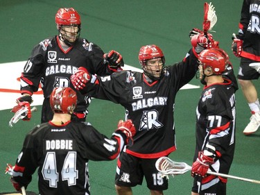 Calgary Roughnecks forward Shawn Evans, centre, in action against the Edmonton Rush last season.