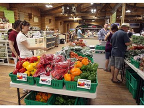 People enjoy the N.W. Symons Valley Ranch farmers market in  Calgary.