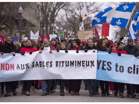 Thousands of people march for a better environment Saturday in Quebec City. People protested as a meeting of Canadian premiers is scheduled on Tuesday in the Quebec capital. An Alberta cabinet minister should be present, the Herald editorial board says.