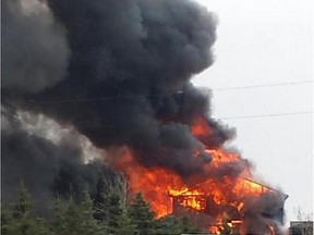 Trent Olson captured this image of a house fire on an acreage south of Airdrie on Sunday, April 5, 2015. It happened near Range Road 264, north of the CrossIron Mills shopping mall, at about 4:30 p.m.