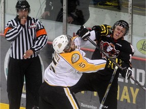 Colton Waltz of the Brandon Wheat Kings shoves Beck Malenstyn of the Calgary Hitmen during Game 5 of their Eastern Conference Final series at Westman Place in Brandon. (File)