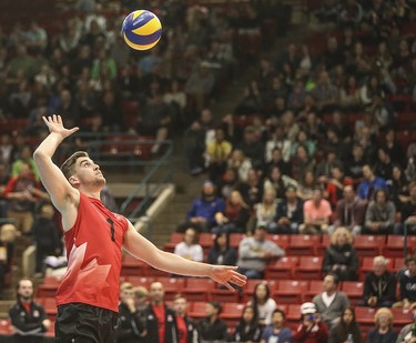 Team Canada's Tyler Sanders delivers up a serve in front of a sold out crowd at the Calgary Corral in Calgary on Sunday, May 17, 2015. The attendance numbers for the Calgary volleyball tournament broke a record set a decade earlier. Team Canada won over Team Cuba, 3-0, in the FIVB World League international men's volleyball tournament.