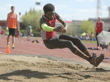 A triple jump competitor comes in for a landing on the far side of the sand pit at Foothills Athletic Park in Calgary on Saturday, May 23, 2015.