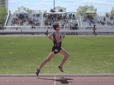 Ryan Smeeton of Henry Wise Wood High School takes victory in the 1500 metre boys intermediate run at the Foothills Athletic Park in Calgary on Saturday, May 23, 2015. Smeeton previously won the CSHSAA 3000 metre boys intermediate run earlier in the day.