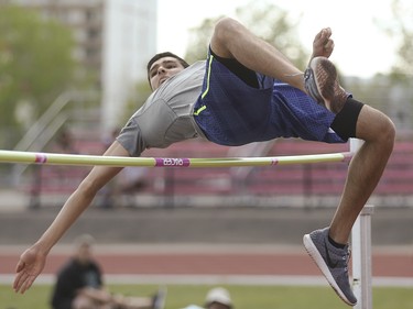 City high school track and field athletes run, contort, and soar in attempts to win the high jump event as part of the CSHSAA championships at the Foothills Athletic Park in Calgary on Saturday, May 23, 2015.