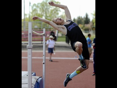 A competitor in high jump from Robert Thirsk High School mistimes, jumps early, and fails to cleanly clear the bar as part of the CSHSAA track and field championships at the Foothills Athletic Park in Calgary on Saturday, May 23, 2015.
