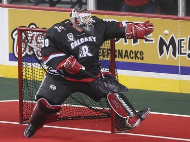 Roughnecks goalie Mike Poulin reaches out to grab the ball after a wide shot on net by the Edmonton Rush at the Scotiabank Saddledome in Calgary on Saturday, May 23, 2015. The Calgary Roughnecks led the Edmonton Rush, 9-7, in the first half of game two of the National Lacrosse League west division final.