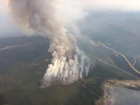 The area along part of Old Smith Highway was evacuated Monday due to an out of control, 500-hectare fire burning 25 kilometres east of Slave Lake.