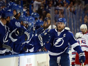 Steven Stamkos #91 of the Tampa Bay Lightning celebrates with his teammates after scoring a goal.
