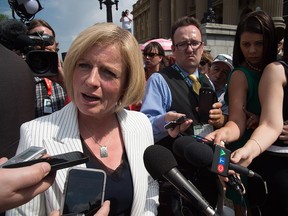 EDMONTON, ALTA: ¨ÜMAY 24, 2015 -- Premier  Rachel Notley speaks to the media after  her and 11 cabinet ministers are sworn in on the legislature steps in Edmonton . May 24, 2015. (Photo by Bruce Edwards / Edmonton Journal)