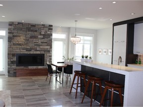 The great room and kitchen at the Carlingford, by McKee Homes in Cooper's Crossing, Airdrie.