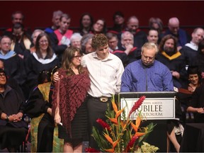 Ronda-Lee Rathwell, left, receives an honorary degree from ACAD for her late son Zackariah at the Southern Alberta Jubilee Auditorium in Calgary on Thursday, May 14, 2015.