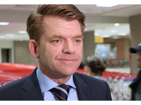 Wildrose Leader Brian Jean talks with the media after arriving at Calgary International Airport on May 3, 2015.