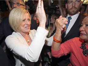 NDP Leader Rachel Notley heads to the stage to celebrate her majority victory in the provincial election in Edmonton on Tuesday.