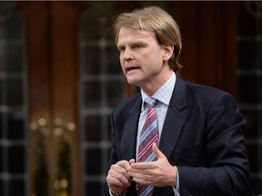 Immigration Minister Chris Alexander answers a question during question period in the House of Commons on Parliament Hill in Ottawa on Monday, May 25, 2015.