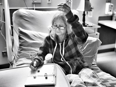 Barbi Harris plays a game to pass the time in the hopital.