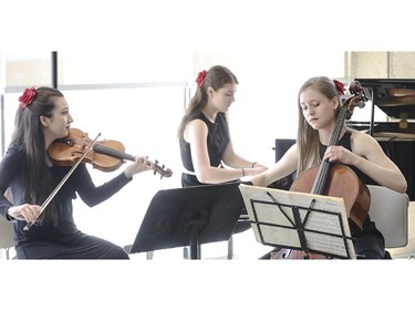 Isabella Perron, left, Anastasia Kulikova and Mari Coetzee of the Passion Palette Trio play at the introduction the new concert season at the Bella Concert Hall in Calgary on Friday, May 1, 2015.