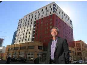 New Mustard Seed CEO Dr. Stephen Wile was photographed in front of the organization's new 1010 Centre low income apartment building in Calgary's beltline.