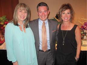 Cal 0523 Upaway 1 The 6th annual Up & Away Charity Gala held May 7 in the Palomino Room raised 30% more than last year's gala. No small feat in these challenging economic times. Pictured at the gala, from left, are volunteer Carrie Grant, UP board chair Tony Ciarla and UP CEO Patricia Jones.