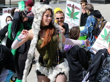 Tifa Ocampo dances at the annual Global Marijuana March at City Hall and along Stephen Avenue Mall on Saturday May 2, 2015.