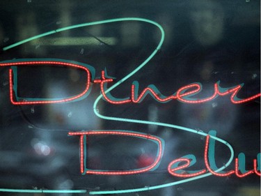 The neon sign in the window of Diner Deluxe on Edmonton Trail.