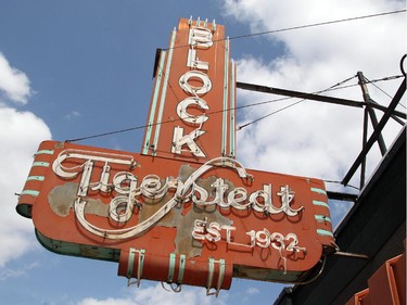 The neon sign on the Tigerstadt Block on Centre Street North in Crescent Heights as seen Wednesday May 13, 2015.
