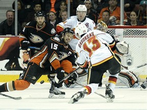 Ryan Getzlaf of the Anaheim Ducks attempts to block a shot on goal by Johnny Gaudreau of the Calgary Flames in Game 5 of the Western Conference semifinals on Sunday. Despite long odds all season, the Flames never quit.