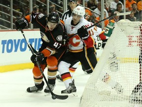 Johnny Gaudreau goes against Hampus Lindholm  of the Anaheim Ducks during Game 2 on Sunday.