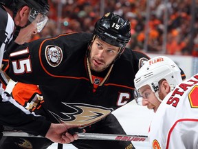 Anaheim Ducks superstar Ryan Getzlaf, seen facing off against Calgary's Matt Stajan in Game 2, is one of three nominees for the Mark Messier Leadership Award.