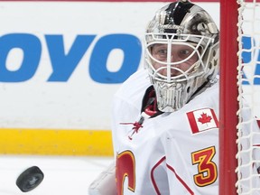 Calgary goaltender Karri Ramo watches the puck bounce during the second period of Game 1 in the second round of the NHL Stanley Cup playoffs, Thursday, April 30, 2015, in Anaheim, Calif.