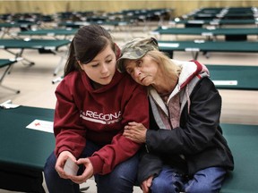 Barbi Harris, a homeless woman who battled addictions and cancer, spends a moment with Cheyenne, the daughter she put up for adoption years ago.