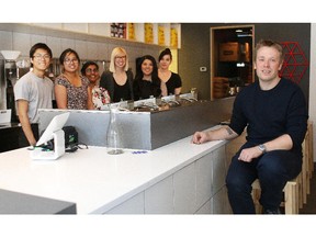 Sam Friley, right, with Andrew Lee, Jessie Salcedo, Afrida Ahmed, Jenelle Nicolafsen, Nina Pinlac and Kaci Switzer, has recently opened a new waffle restaurant called Buttermilk on 17 Ave S.W.  Lorraine Hjalte/Calgary Herald