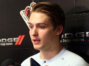 Jake Virtanen talks to the media as the Calgary Hitmen cleaned out their lockers on Sunday.