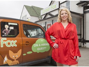 Julia Cordray, chief executive of Career Fox Inc. and 96 Talents, in front of the Career Fox vehicle and office along 14th Street N.W. in Calgary.